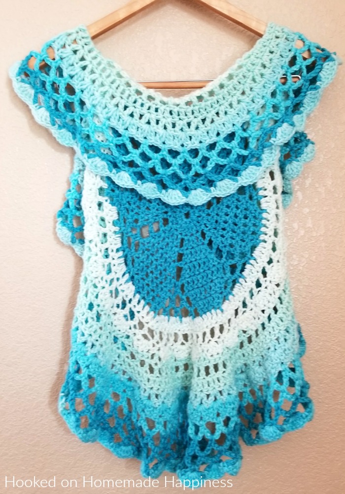 Crochet Circle Vest - I love circle vests! They're such a fun accessory. For this Crochet Circle Vest Pattern I wanted to use a Caron Cake. Because who doesn't love stripes without weaving in all the ends, amiright?