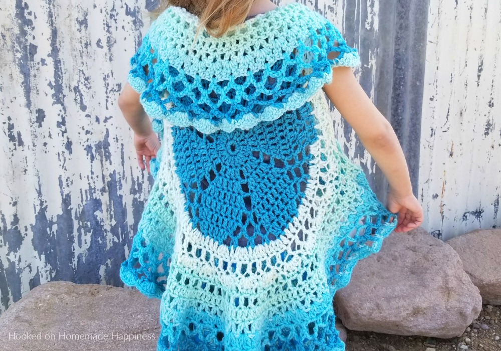 Crochet Circle Vest - I love circle vests! They're such a fun accessory. For this Crochet Circle Vest Pattern I wanted to use a Caron Cake. Because who doesn't love stripes without weaving in all the ends, amiright?