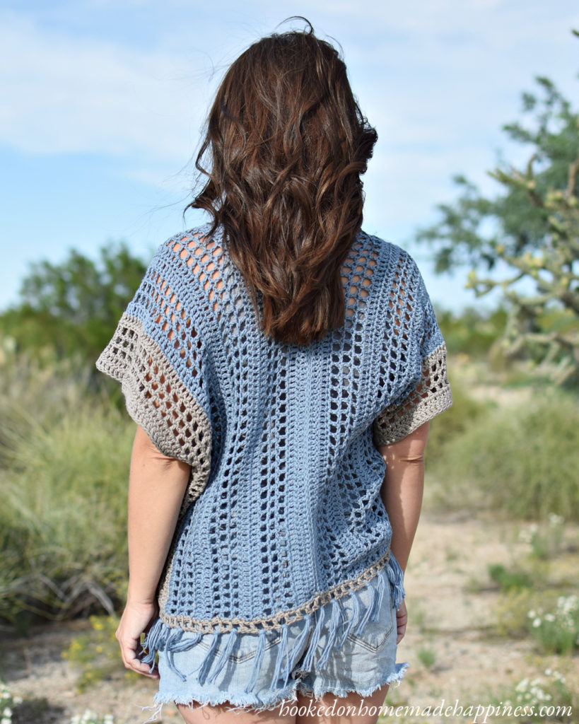 Spring Breeze Poncho Crochet Pattern - This Spring Breeze Crochet Poncho is a simple poncho made with basic stitches. It is as easy as crocheting two rectangles and is perfect for a beginner garment.