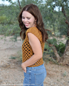 Honeycomb Crochet Top Pattern - The Honeycomb Crochet Top has a beautiful honeycomb design and it fits perfectly with the golden yarn. This top is made with an open, airy stitch called the Honeycomb Stitch. 