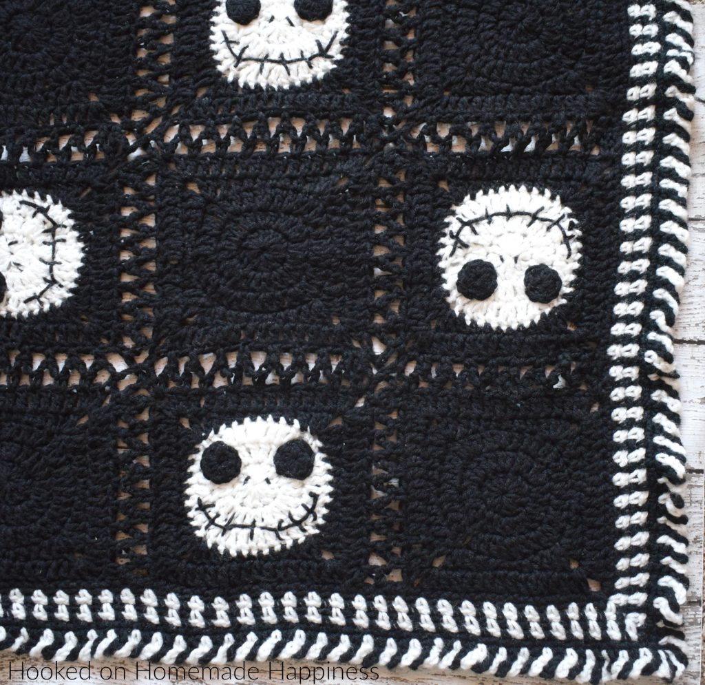 Halloween Crochet Blanket - Have some Halloween fun with this Halloween Crochet Blanket! It's the perfect size to wrap up in while watching your favorite Halloween movie!