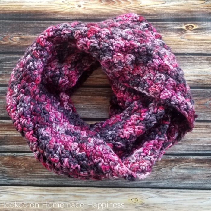 Claret Infinity Scarf Crochet Pattern - Wrap yourself in this easy and beautiful Claret Infinity Crochet Scarf Pattern. I used the Suzette Stitch; the ease and texture of this stitch makes it one of my favorite stitches.