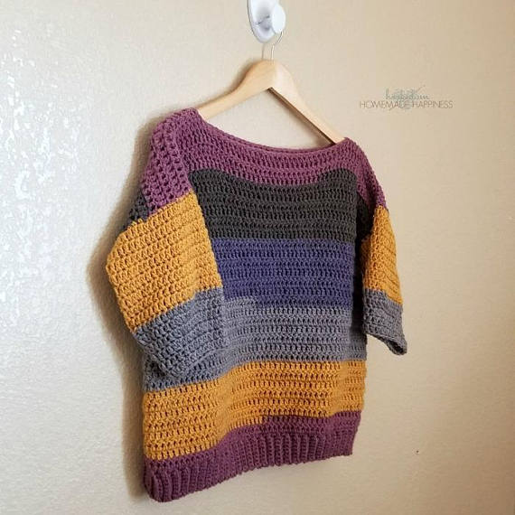 Everygirl Crochet Sweater Pattern - This comfy, easy to make Everygirl Crochet Sweater is the perfect addition to your fall wardrobe. I used 2 Caron Cakes to make this sweater. When picking out my skeins, I made sure to find ones that had the same starting color so the stripes on the front and back out (almost) match up.