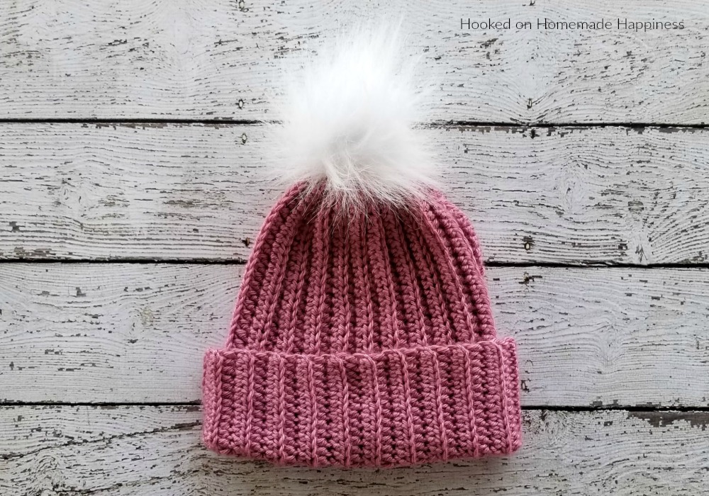 Classic Beanie Crochet Pattern - This Classic Beanie Crochet Pattern has a classic design, but is made a little differently than your typical crocheted hat. It's worked as a rectangle and then sewn into a hat. There's a little bit of ribbing to add some subtle texture and the double brim will help keep ears extra warm.