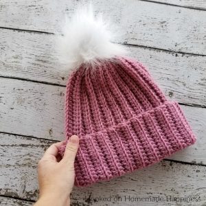 Classic Beanie Crochet Pattern - This Classic Beanie Crochet Pattern has a classic design, but is made a little differently than your typical crocheted hat. It's worked as a rectangle and then sewn into a hat. There's a little bit of ribbing to add some subtle texture and the double brim will help keep ears extra warm.