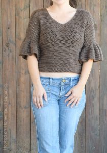 Ruffle Top Crochet Pattern - This Ruffle Top Crochet Pattern is a fitted, short top with cute ruffled sleeves. It's a great top for spring! It's not too heavy and with the 3/4 sleeve it gives a bit of warmth without being too hot.