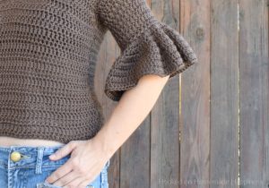 Ruffle Top Crochet Pattern - This Ruffle Top Crochet Pattern is a fitted, short top with cute ruffled sleeves. It's a great top for spring! It's not too heavy and with the 3/4 sleeve it gives a bit of warmth without being too hot.