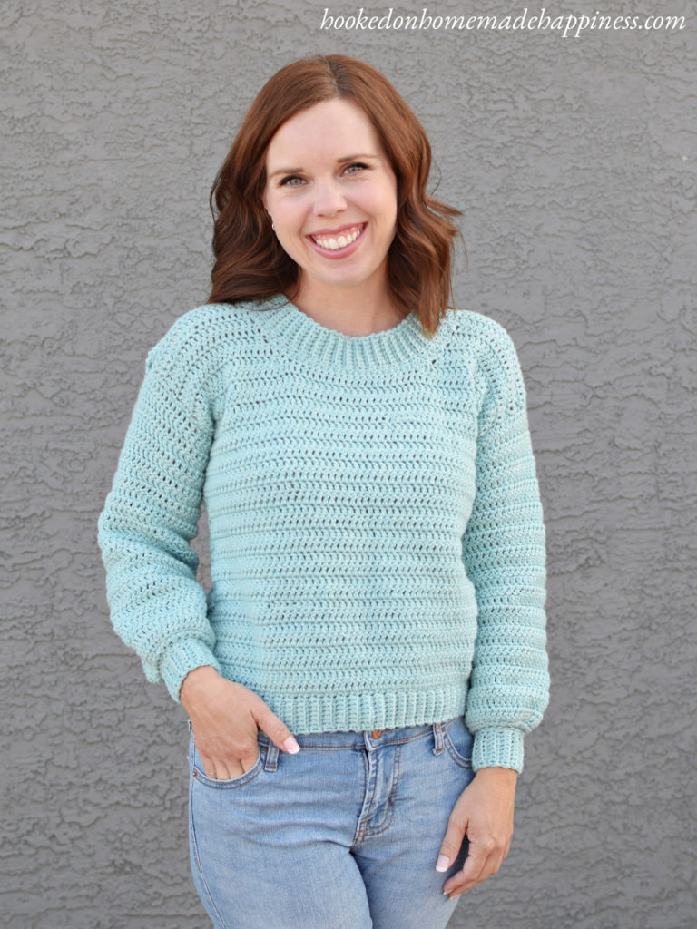 Simple Eyelet Sweater Crochet Pattern - For this Simple Eyelet Sweater Crochet Pattern, there is a full video tutorial! The front of the sweater is a solid piece, made with all double crochet. The back has the open, see through look that is just so cute! I like to wear it with a brightly color tank top. Even just a sports bra would be adorable!