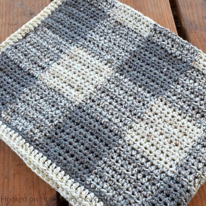 Neutrally Gingham Crochet Baby Blanket Pattern - This Neutrally Gingham Crochet Baby Blanket Pattern is perfect for a baby boy or girl! It uses two strands of worsted weight yarn and an 8.0 mm hook, so it works up fairly quick. I promise, it's easier than it looks! Once you get the hand of the repeat, you'll be hooking this baby blanket up in no time!