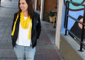 Sunshine Crochet Scarf Pattern - Let the warm sunshine in with this Sunshine Crochet Scarf Pattern! It's made with a super lightweight cotton and that makes it perfect for warmer weather. It hangs loose around the neck so you don't have to worry about getting too warm with this scarf.