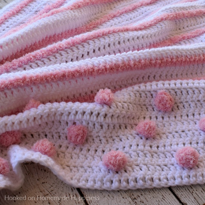 Touch and Feel Baby Blanket Crochet Pattern - I love all the textures in this Touch and Feel Baby Blanket Crochet Pattern! From the different yarns and different stitches there's a lot for baby to touch and feel. Baby will love spending tummy time on this blanket!