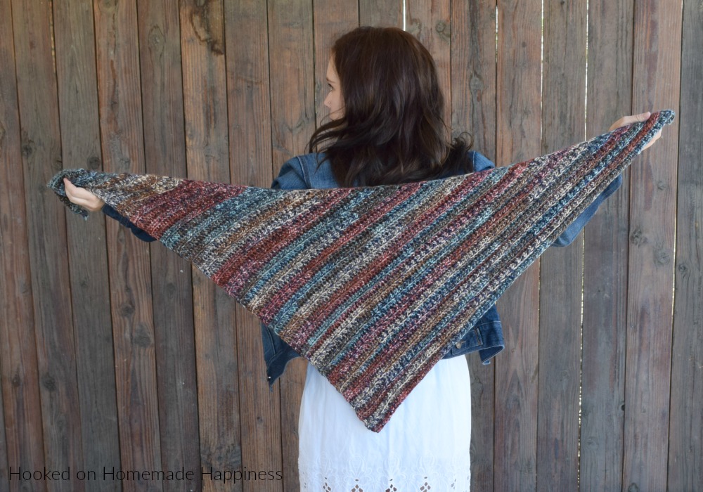 The Fall Shawl Crochet Pattern - The Fall Shawl Crochet Pattern is an easy asymmetrical shawl style scarf. The yarn I used has beautiful jewel tones that are perfect for a fall accessory.