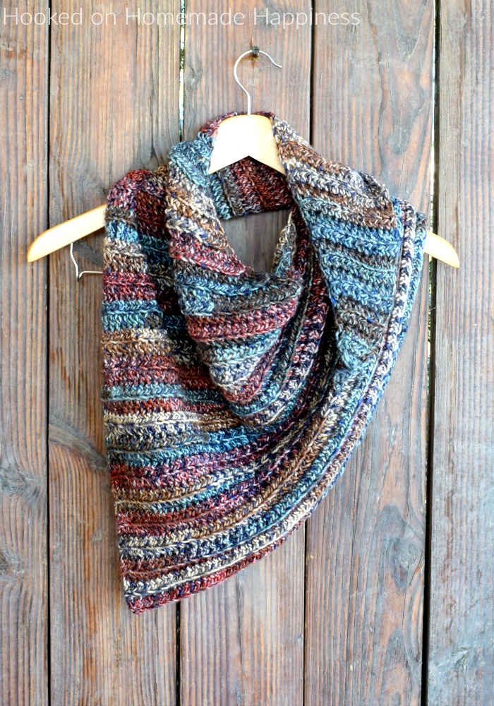 The Fall Shawl Crochet Pattern - The Fall Shawl Crochet Pattern is an easy asymmetrical shawl style scarf. The yarn I used has beautiful jewel tones that are perfect for a fall accessory.