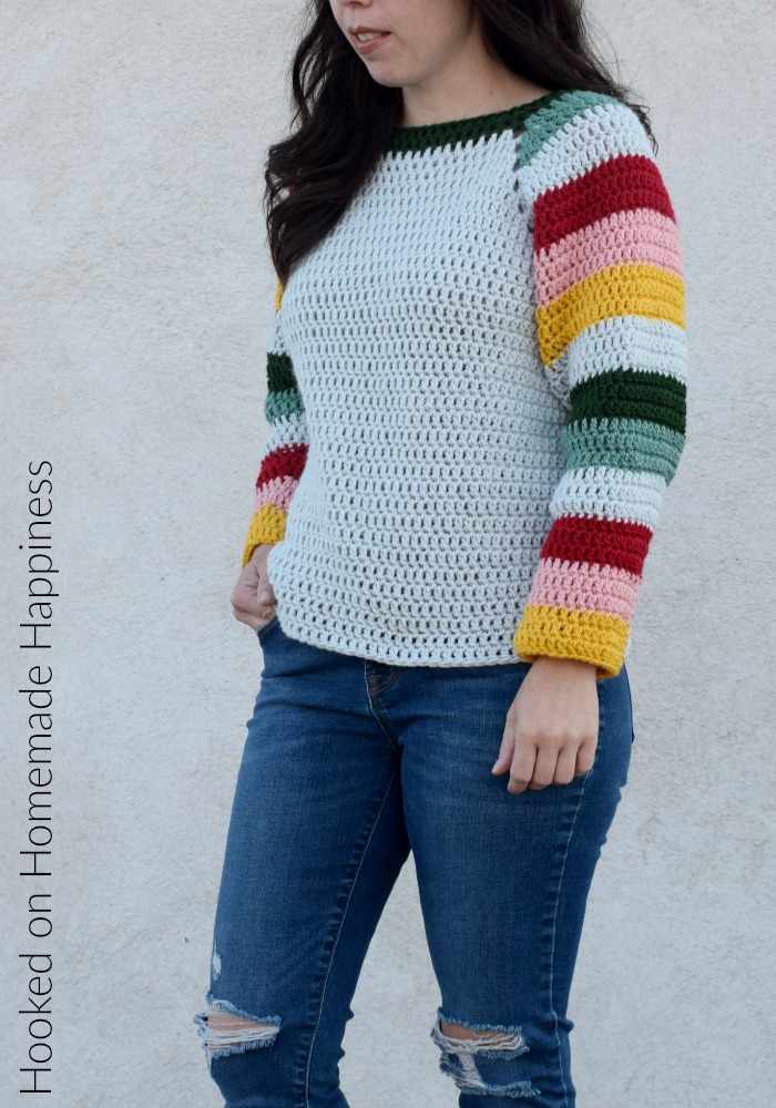 Mod Christmas Sweater Crochet Pattern - This Mod Christmas Sweater Crochet Pattern is a raglan style sweater with cute striped sleeves. I went with some modern Christmas colors for my sleeves, but they can be made in any color combination.