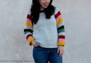Mod Christmas Sweater Crochet Pattern - This Mod Christmas Sweater Crochet Pattern is a raglan style sweater with cute striped sleeves. I went with some modern Christmas colors for my sleeves, but they can be made in any color combination.