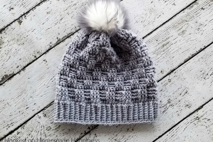 Woven Beanie Crochet Pattern - The Woven Beanie Crochet Pattern uses the basket weave stitch to create this pretty woven look. I love all the different textures of this beanie with the ribbed brim, the basket weave, and the fun pom pom.