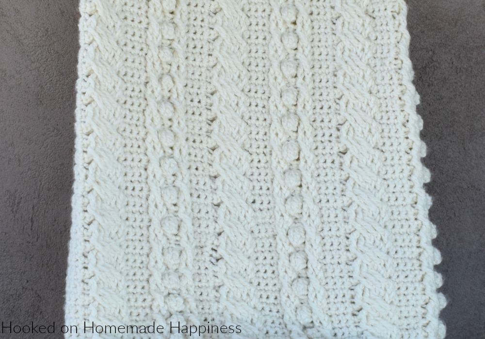 Cable Crochet Blanket Pattern - The Crochet Cable Blanket Pattern is full of beautiful texture and is easier than it looks! With a 4 row repeat you can create these gorgeous cables.