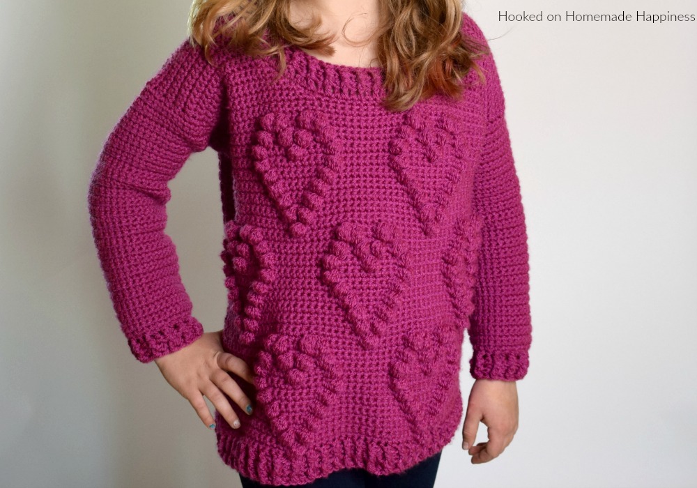 Sweetheart Sweater Crochet Pattern - This adorable Sweetheart Sweater Crochet Pattern has a fun heart pattern made with one of my favorite stitches... the bobble stitch!