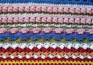 Welcome to Part 13 of the Stitch Sampler Scrapghan CAL! Only a couple weeks left until we're all done! This week is the Shell Stitch. It's a pretty stitch that I've used on a couple hat designs.