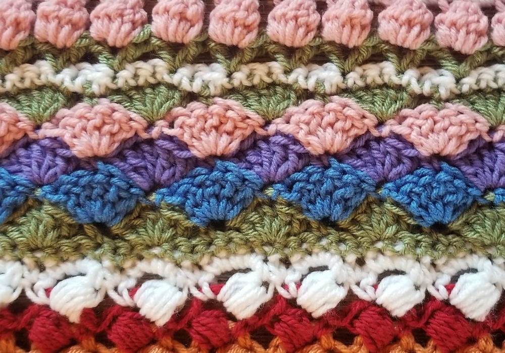 Welcome to Part 13 of the Stitch Sampler Scrapghan CAL! Only a couple weeks left until we're all done! This week is the Shell Stitch. It's a pretty stitch that I've used on a couple hat designs.