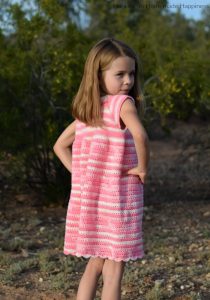 Carson Crochet Dress Pattern - The Carson Crochet Dress Pattern is a pretty spring dress! I designed this dress for my daughter Carson. This dress is TOTALLY her. Pretty, pink, and ruffle-y.