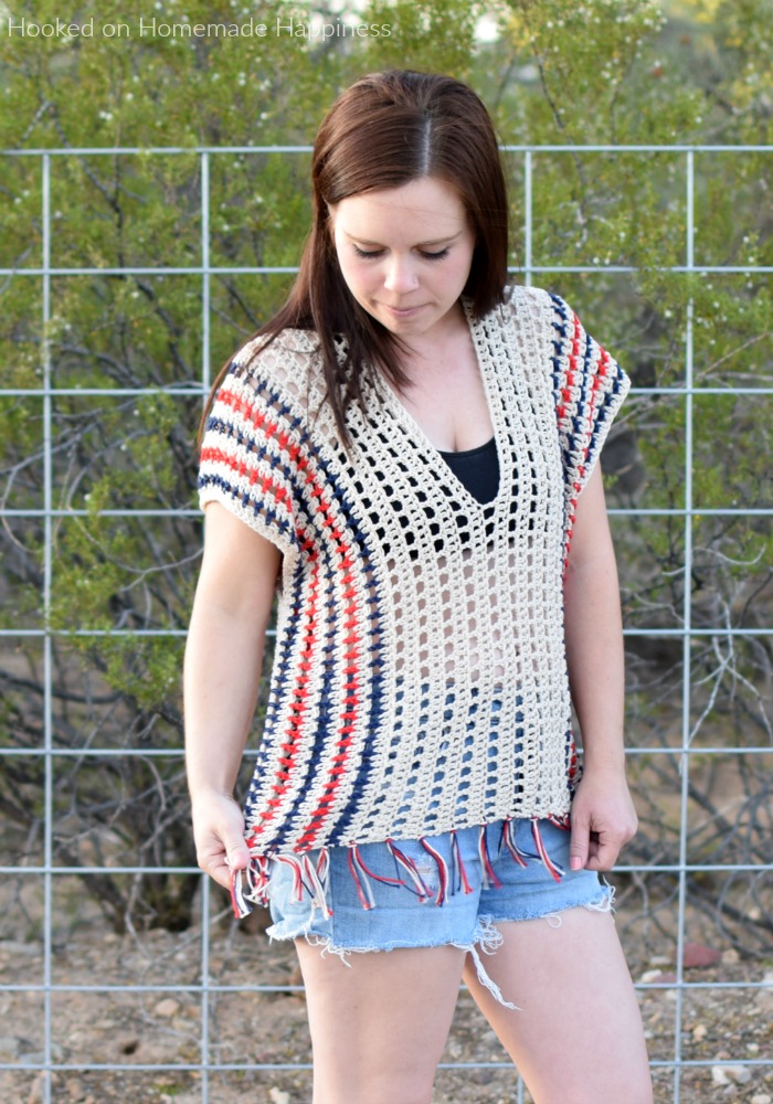 Picnic Poncho Crochet Pattern - The Picnic Poncho Crochet Pattern is made as one piece with very little sewing. Because of the DK weight yarn and the open stitch design, it's perfect for your summer picnic or as a swim suit cover. For mine I used patriotic colors for the summer holidays.