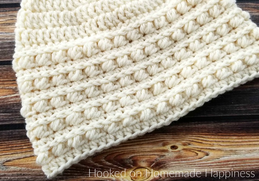 Snowdrop Beanie Crochet Pattern - The Snowdrop Beanie Crochet Pattern starts out with a simple double crochet. Then it uses a combination of half double crochet and the Pebble Stitch to create the pretty textured brim. 