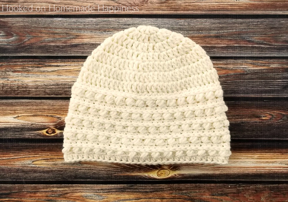 Snowdrop Beanie Crochet Pattern - The Snowdrop Beanie Crochet Pattern starts out with a simple double crochet. Then it uses a combination of half double crochet and the Pebble Stitch to create the pretty textured brim.