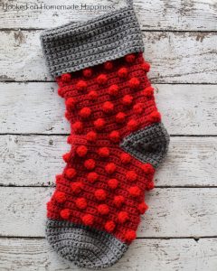Bobble Crochet Stocking Pattern - This Bobble Crochet Stocking Pattern is so festive and cute! Because of the bulky weight yarn, it works up surprisingly fast. This stocking is a good size and can hold LOTS of goodies from Santa!