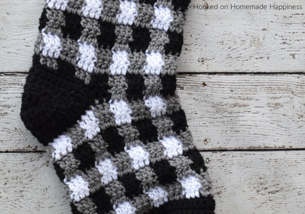 Plaid Crochet Stocking Pattern - This Plaid Crochet Stocking Pattern is so festive and cute! Because of the bulky weight yarn, it works up surprisingly fast. This stocking is a good size and can hold LOTS of goodies from Santa!