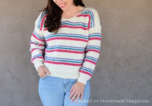 Pulled Taffy Pullover Crochet Pattern - The Pulled Taffy Pullover Crochet Pattern is a lightweight sweater that is perfect for fall and spring. It would also be fun for the holiday season! The stripes would be so cute in Christmas colors.