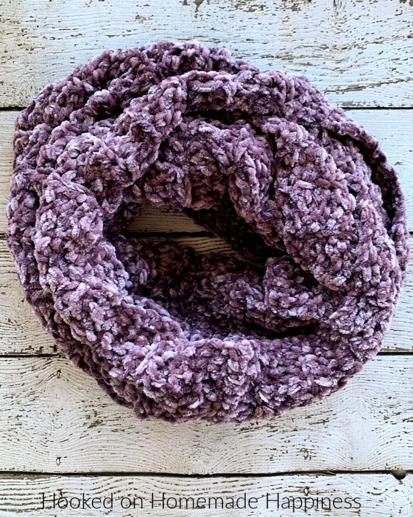 Easy Velvet Infinity Scarf Crochet Pattern - The Easy Velvet Infinity Scarf Crochet Pattern uses just 1 skein of Bernat Velvet yarn. The velvet yarn is so soft and luxurious. It makes such a soft and cozy winter scarf.