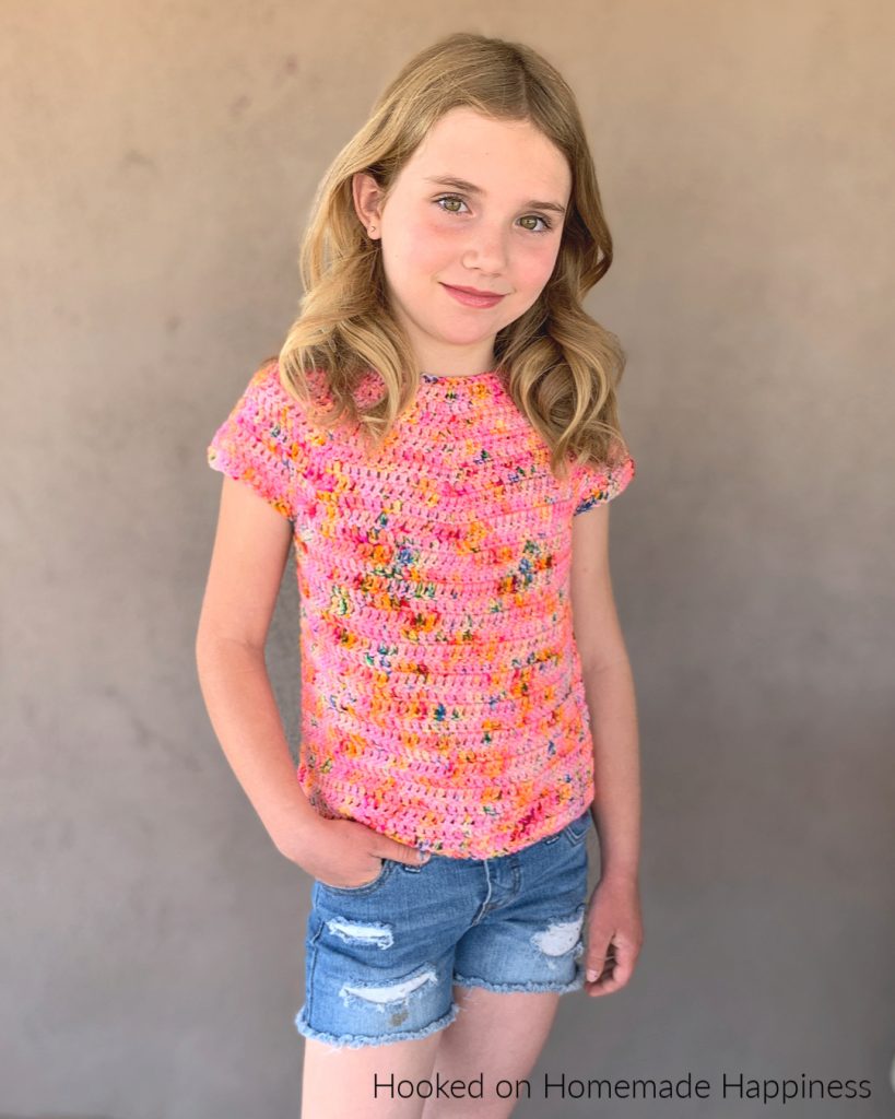 Kid's Basic Tee Crochet Pattern - The Kid's Basic Tee Crochet Pattern is a super easy kid's top that uses worsted weight yarn and all double crochet. The best part is... there's no sewing!