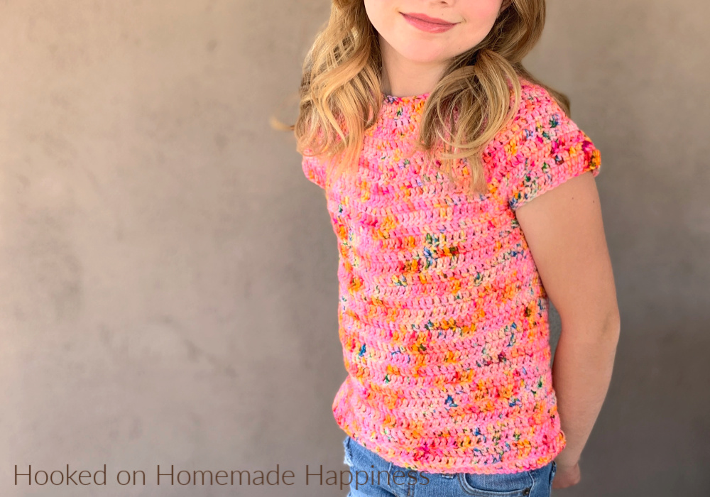 Kid's Basic Tee Crochet Pattern - The Kid's Basic Tee Crochet Pattern is a super easy kid's top that uses worsted weight yarn and all double crochet. The best part is... there's no sewing!