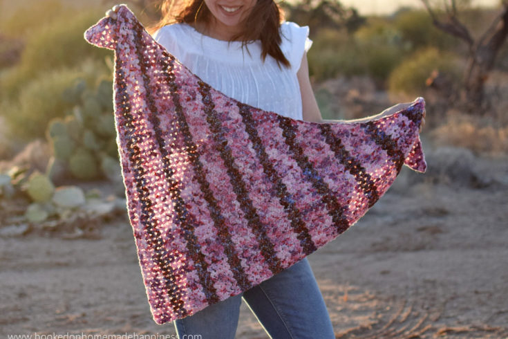 Petal Shawl Crochet Pattern - The Petal Shawl Crochet Pattern uses the pretty cluster V stitch. It creates such a pretty design that reminds me of petals. With just a simple 2 row repeat you can create this gorgeous shawl!