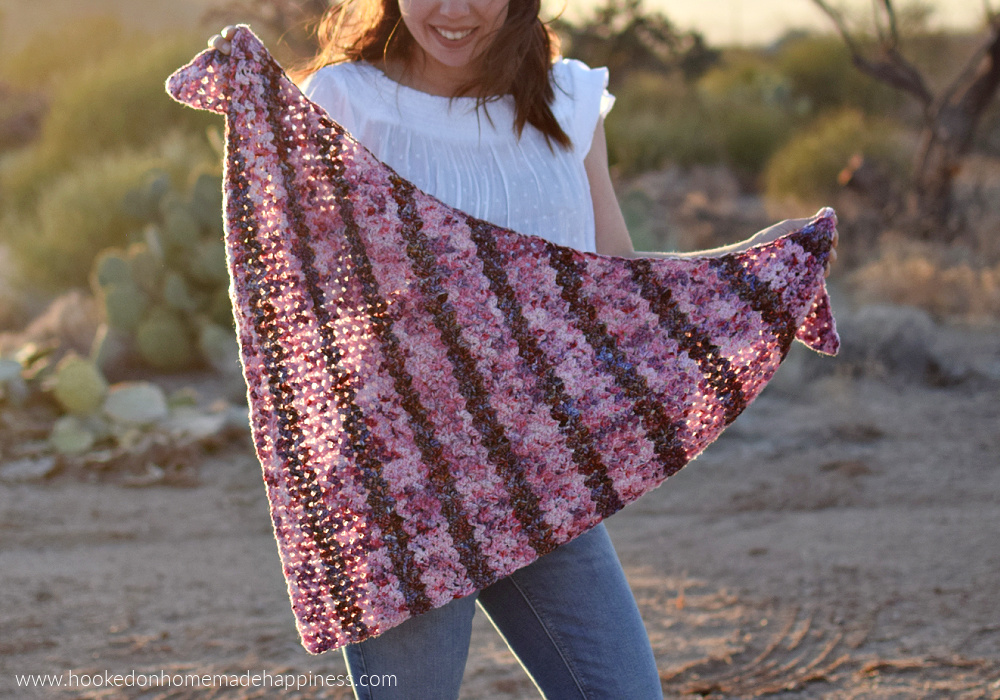 Petal Shawl Crochet Pattern - The Petal Shawl Crochet Pattern uses the pretty cluster V stitch. It creates such a pretty design that reminds me of petals. With just a simple 2 row repeat you can create this gorgeous shawl!