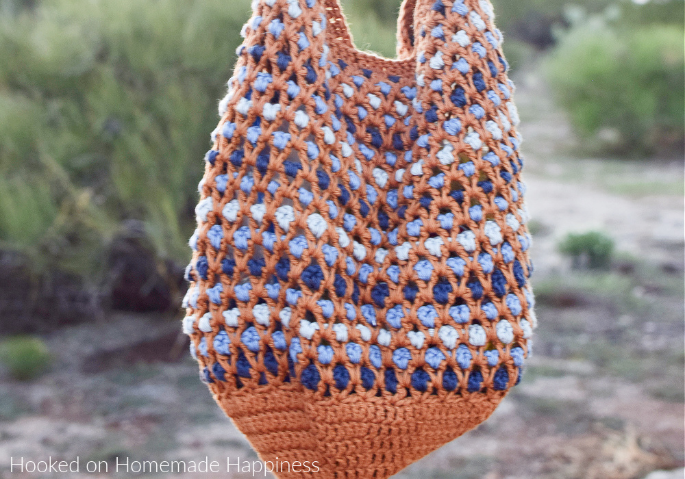 Morocco Market Bag Crochet Pattern - The Morocco Bag Crochet Pattern has such a fun design that's created with a simple V stitch! The stitching looked complicated, but if you know how to double crochet then you can make this bag. It's all about the stitch placement with this texture!