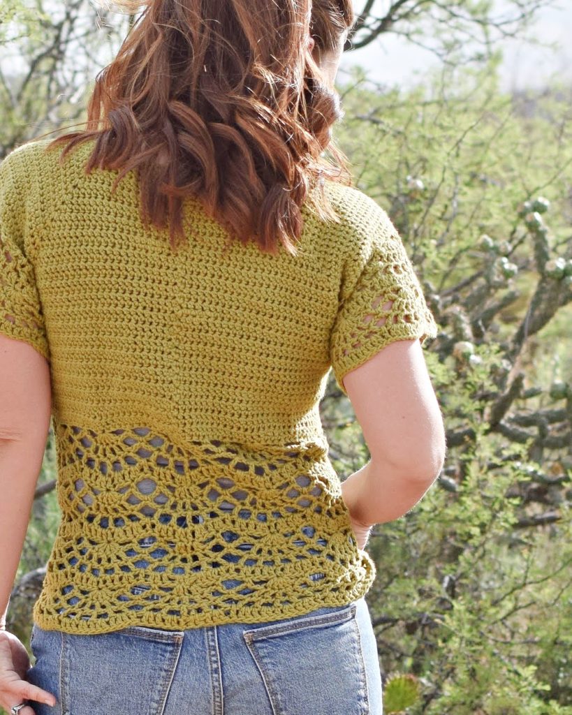 Bahama Blouse Crochet Pattern - The Bahama Blouse Crochet Pattern is a fun and flirty top, perfect for your spring outings. The beautiful lace design along the bottom adds a pretty and feminine touch. This raglan style blouse is worked from the top down and requires no sewing.