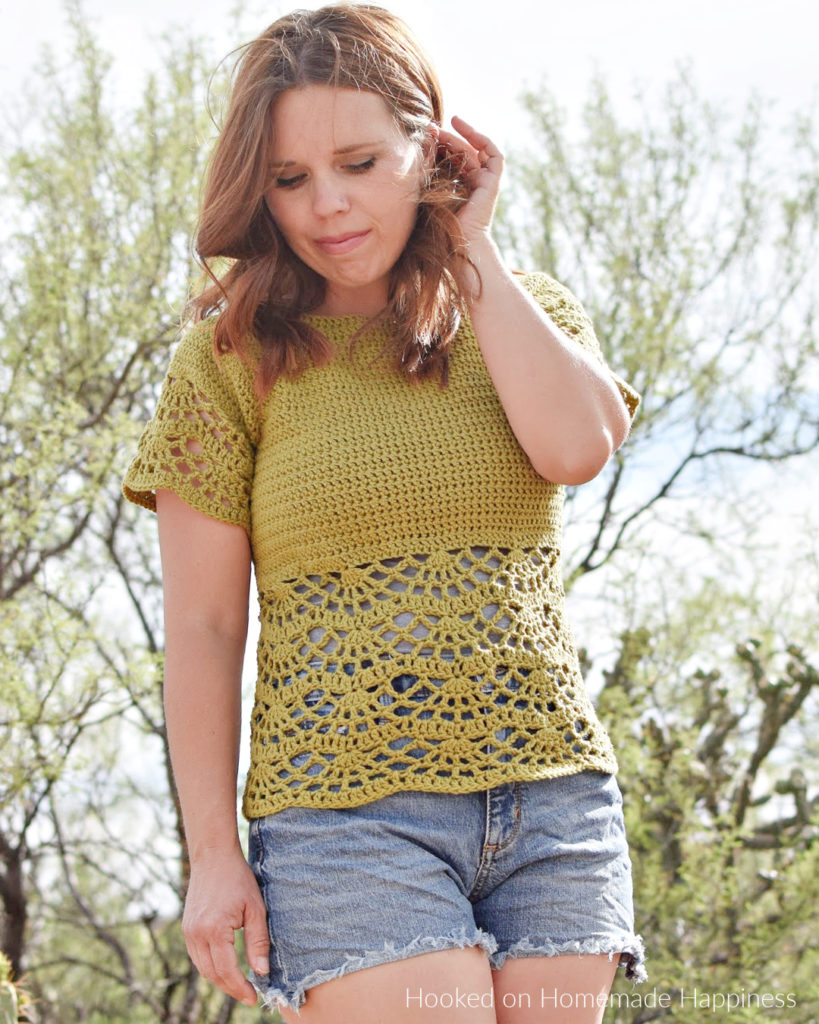 Bahama Blouse Crochet Pattern - The Bahama Blouse Crochet Pattern is a fun and flirty top, perfect for your spring outings. The beautiful lace design along the bottom adds a pretty and feminine touch. This raglan style blouse is worked from the top down and requires no sewing.