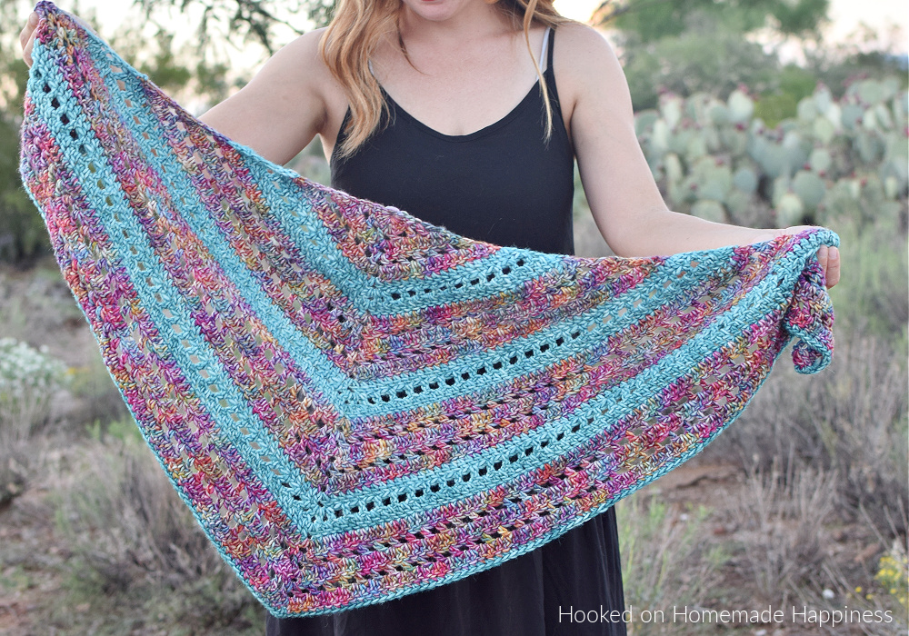Stained Glass Triangle Wrap Crochet Pattern - The Stained Glass Triangle Wrap Crochet Pattern is a beginner level shawl. The only stitches needed are double crochet and chain stitch! I love how those two simple stitches can create such a pretty design.