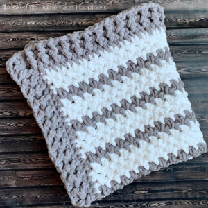 Braydon Baby Blanket Crochet Pattern - The Braydon Baby Blanket Crochet Pattern is an easy & quick baby blanket. Because of the super bulky yarn and the 1 row repeat, I was able to make it in just a day!