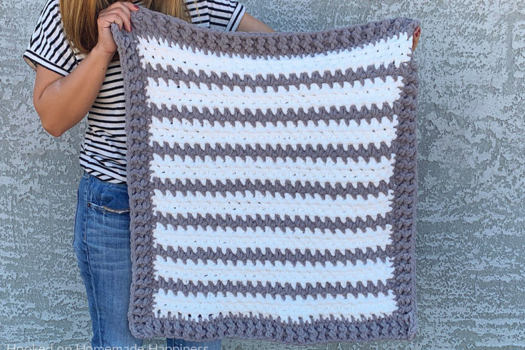 Braydon Baby Blanket Crochet Pattern - The Braydon Baby Blanket Crochet Pattern is an easy & quick baby blanket. Because of the super bulky yarn and the 1 row repeat, I was able to make it in just a day!