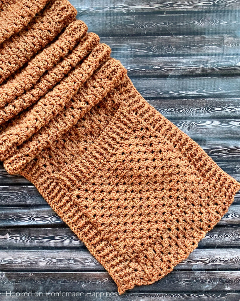 Persimmon Pocket Shawl Crochet Pattern - The Persimmon Pocket Shawl Crochet Pattern is the perfect pattern to get you ready for fall! It uses the classic granny stitch with a textured ribbing.