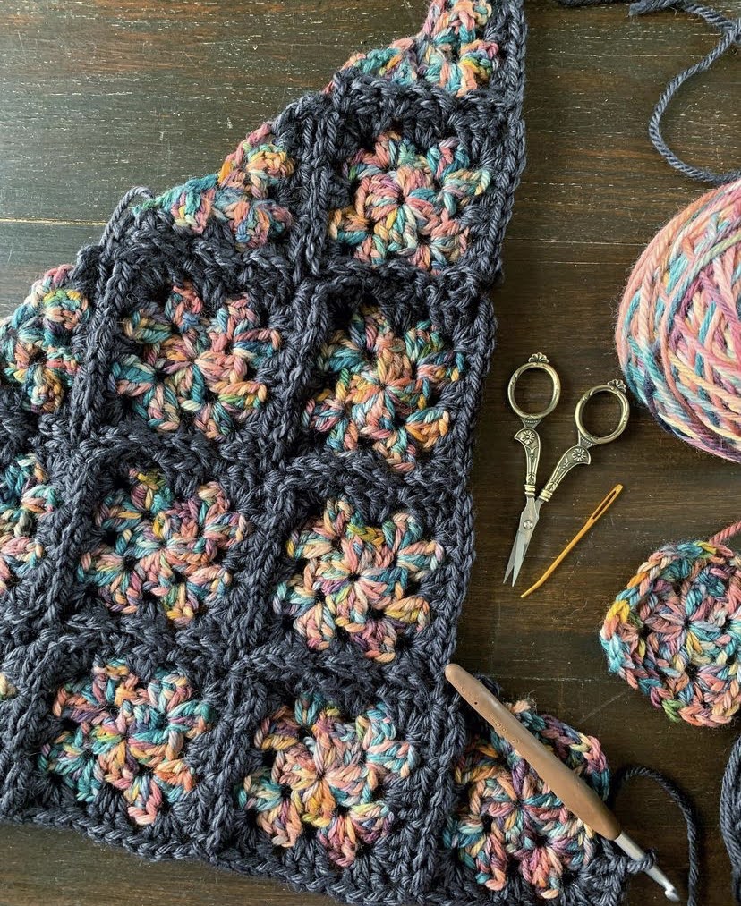 Granny Square Cowl Crochet Pattern - ade up of a few granny squares (and a couple triangles) sewn together into a cowl shape. All you need to know is how to make a basic granny square for this simple cowl.