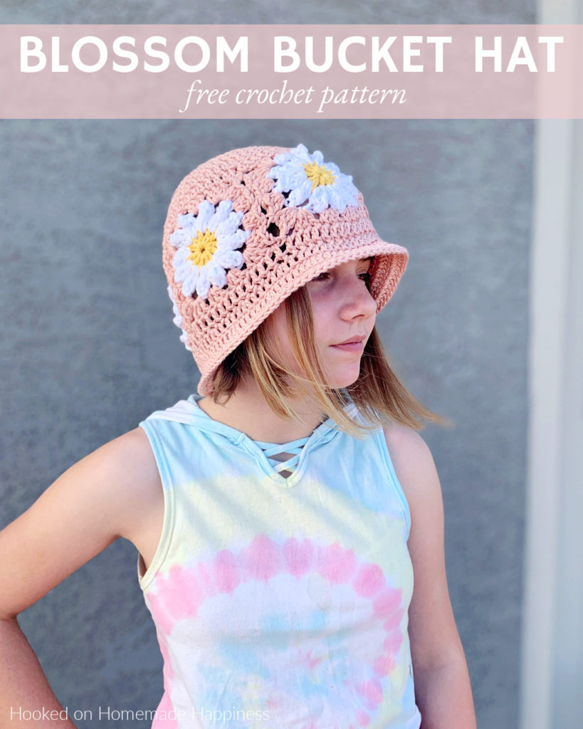 Blossom Bucket Hat Crochet Pattern - This adorable Blossom Bucket Hat Crochet Pattern starts with a simple flower granny square pattern! The the top of the hat and the brim are added. 