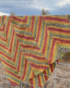 Horizon Blanket Crochet Pattern - is blanket is worked in long panels that are sewn together to create this chevron or zig-zag look.
