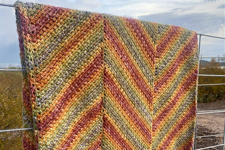 Horizon Blanket Crochet Pattern - is blanket is worked in long panels that are sewn together to create this chevron or zig-zag look.