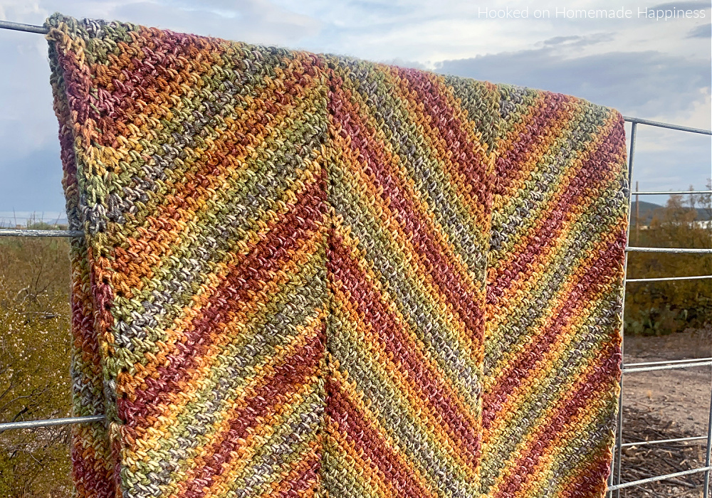 Horizon Blanket Crochet Pattern - is blanket is worked in long panels that are sewn together to create this chevron or zig-zag look.