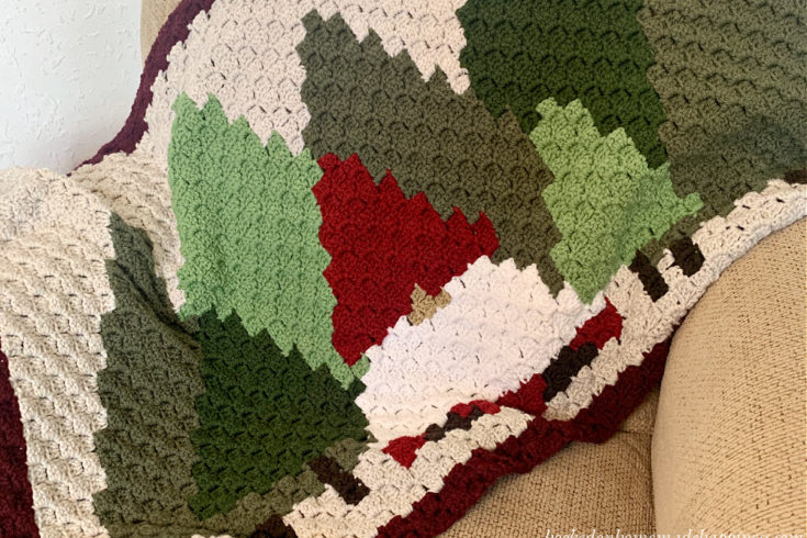 This Christmas Gnome Blanket C2C Crochet Pattern is so fun to work up! It's a small lapghan that's perfect for hanging over the back of a sofa.