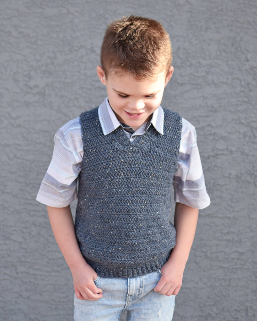 Kid's Sweater Vest Crochet Pattern - The Kid's Sweater Vest Crochet Pattern is an adorable accessory for any special occasion! Because it's make with DK weight yarn, it isn't too heavy and can be worn in transitional months. 